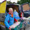 Volunteers loading food into a van